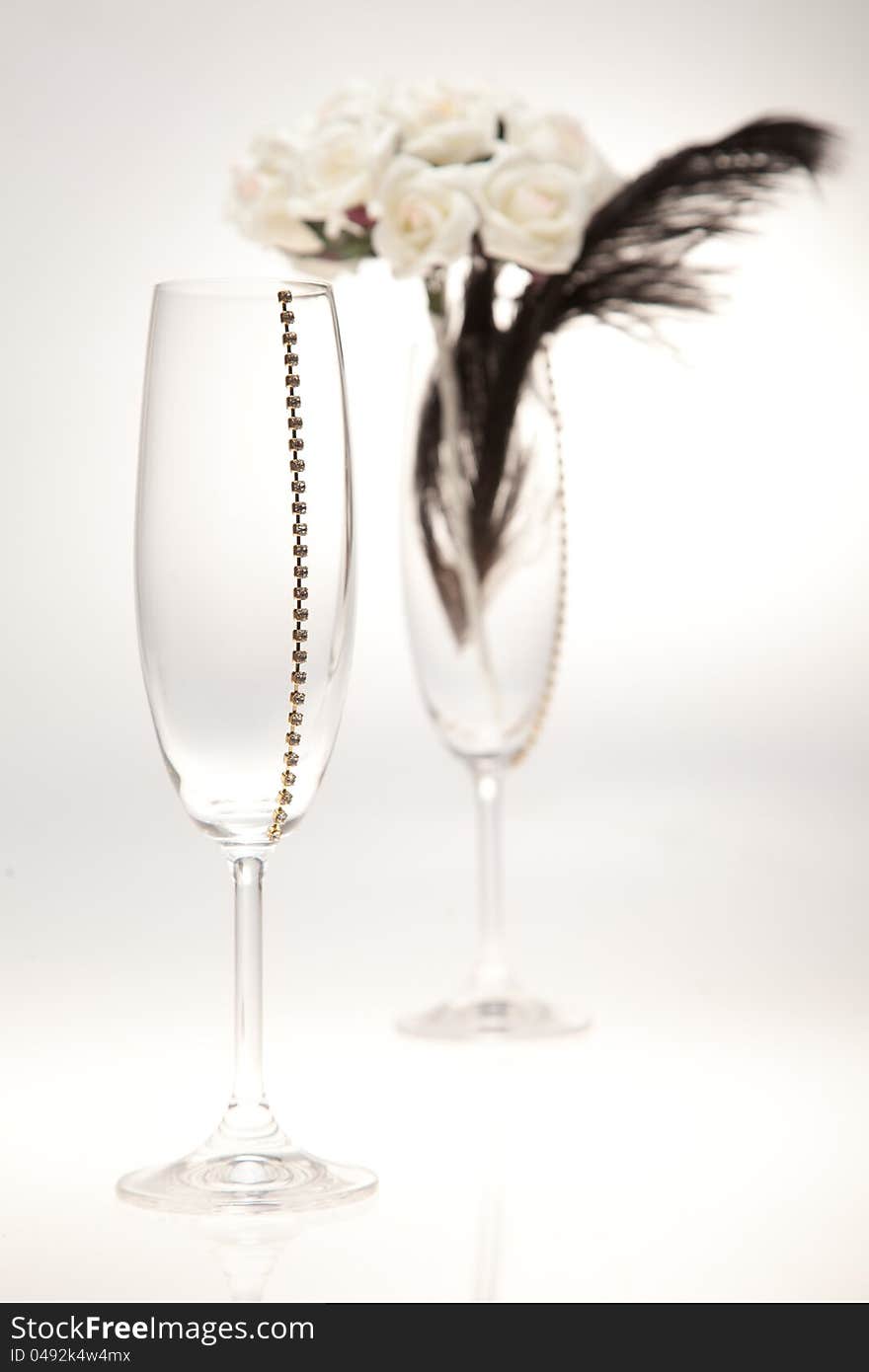 Bouquets and glasses on a white background. The background blurred.