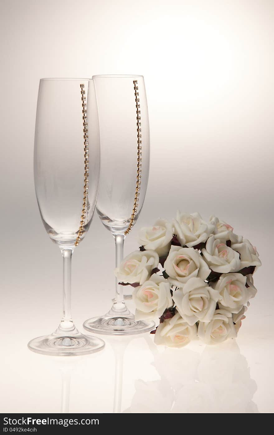 Bouquets and glasses on a white background. A bouquet of white flowers.