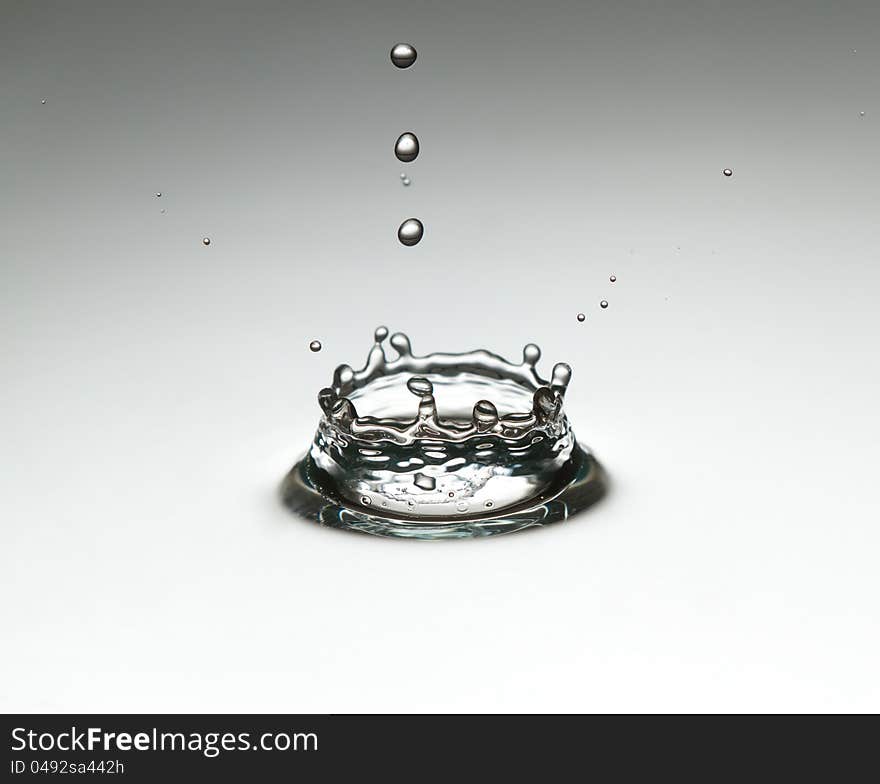 The drop, which falls into the water. Spray fly like a crown.