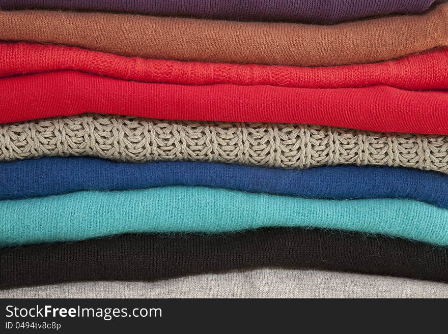 Folded Sweaters in a Pile