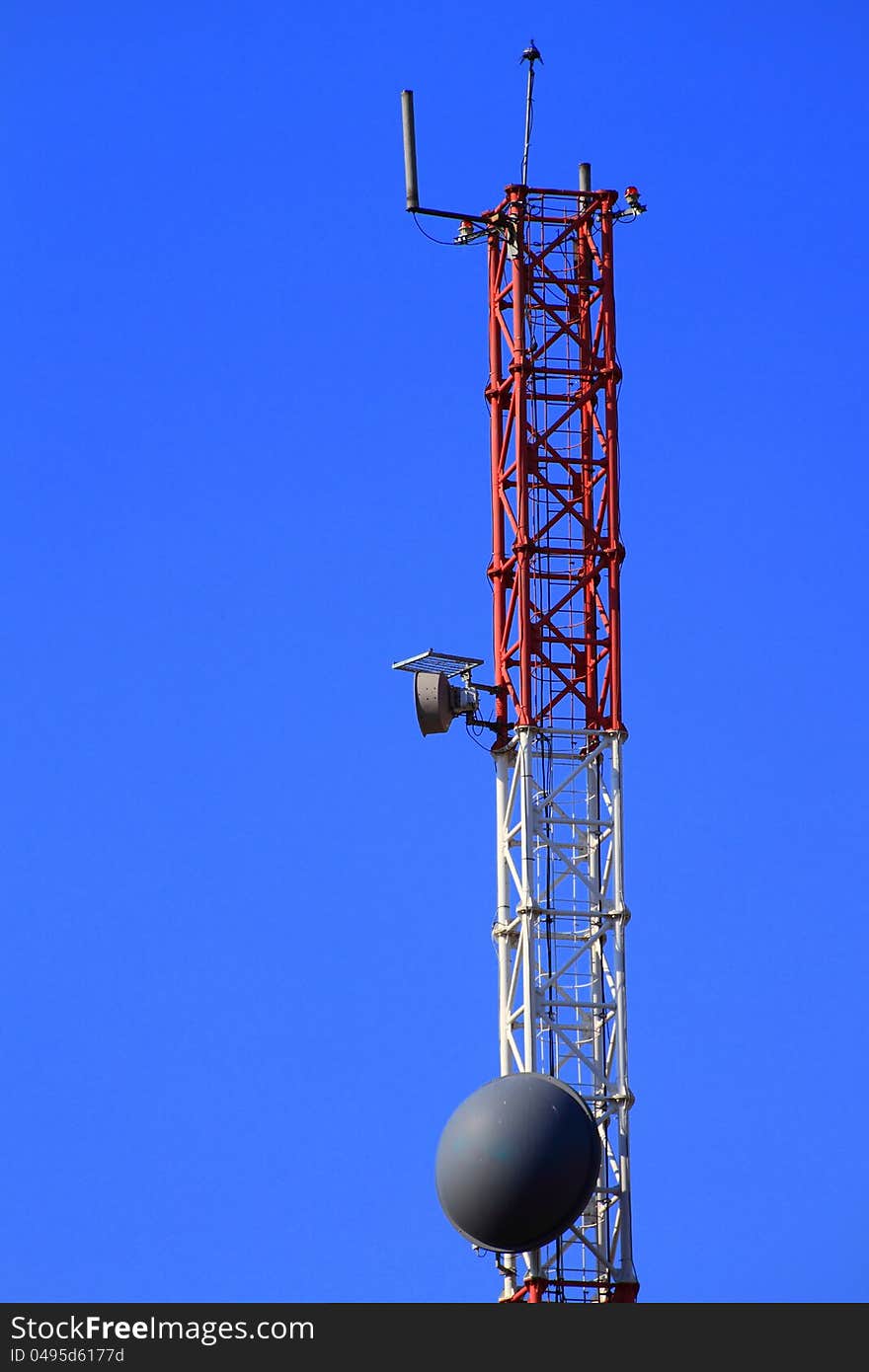 Metallic structure for a tv and radio antenna with blue sky background. Metallic structure for a tv and radio antenna with blue sky background