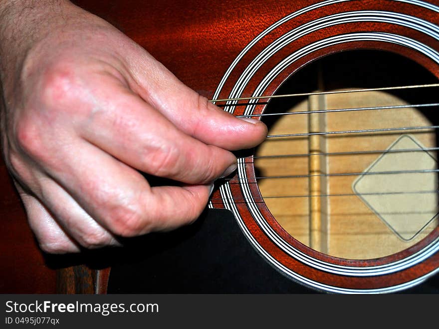 Classic guitar player close up view during a performance