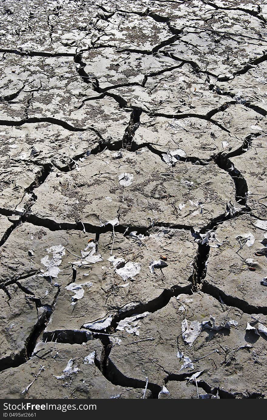 Wide angle close-up of clay soil cracked by drought. Wide angle close-up of clay soil cracked by drought.