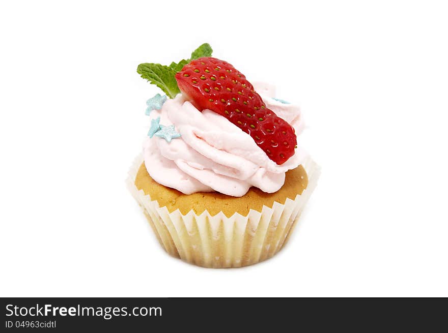 A small cake with cream on a white background. A small cake with cream on a white background