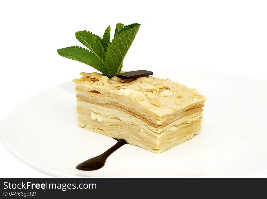 Layered dessert on a white background decorate with mint. Layered dessert on a white background decorate with mint