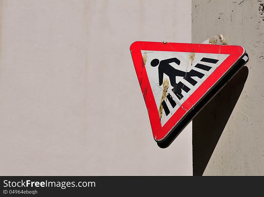 Broken pedestrian crossing road sign