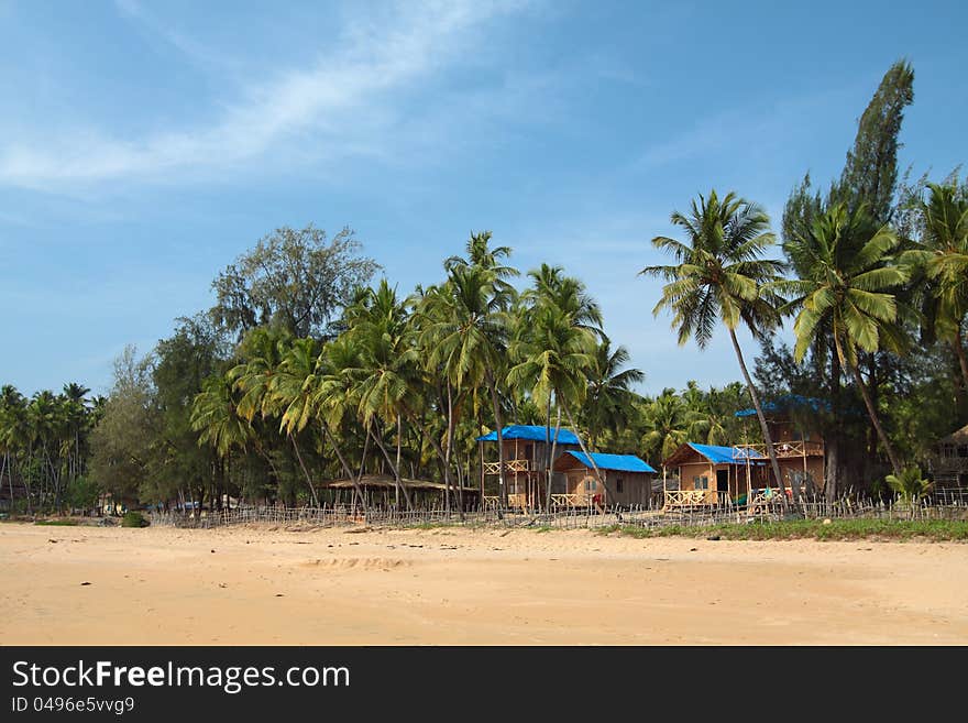 Beautiful view of beach, summer houses and palm trees in Polem, Goa, India. Beautiful view of beach, summer houses and palm trees in Polem, Goa, India