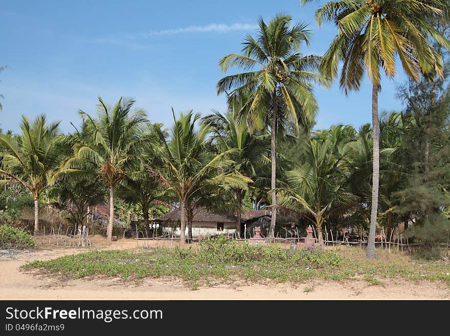 Beautiful view of beach, summer houses and palm trees in Polem, Goa, India. Beautiful view of beach, summer houses and palm trees in Polem, Goa, India