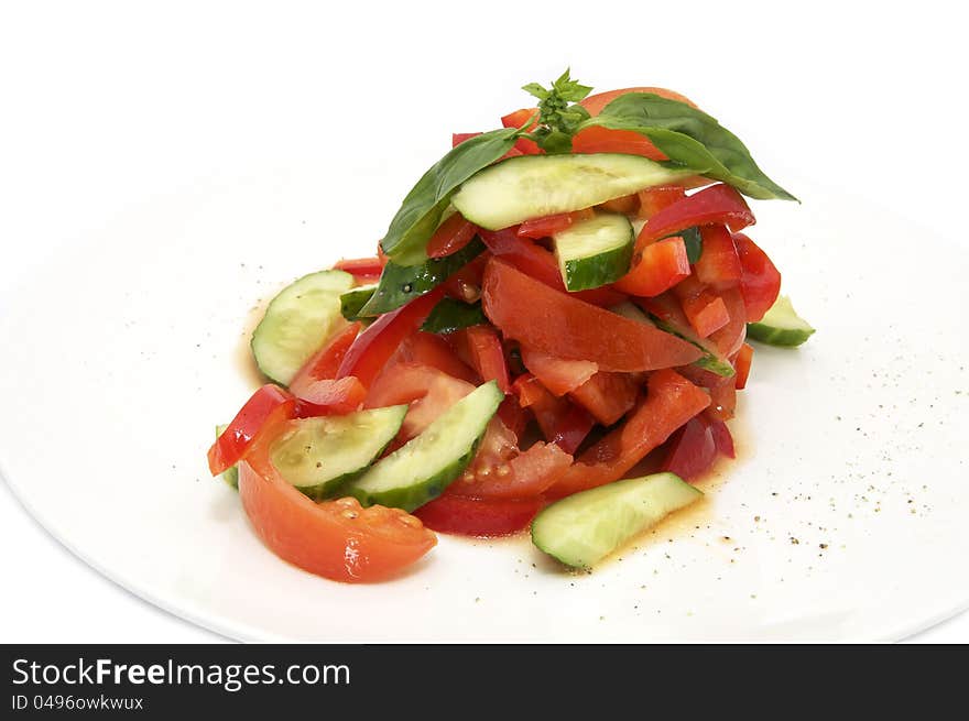 Salad and vegetable oil on a white plate. Salad and vegetable oil on a white plate