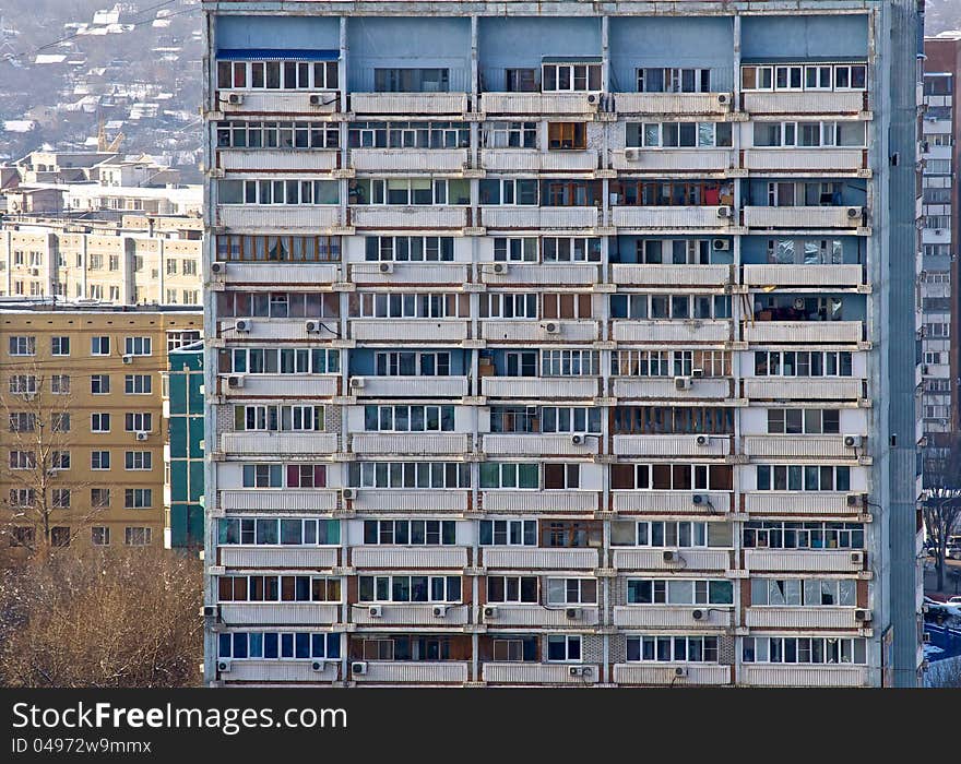 Modern city buildings reminiscent of a beehive. People like bees hiding in their combs. Modern city buildings reminiscent of a beehive. People like bees hiding in their combs.