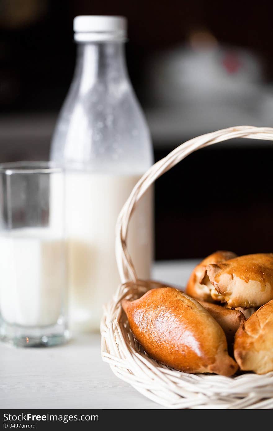 Cakes on basket with cup milk. Cakes on basket with cup milk