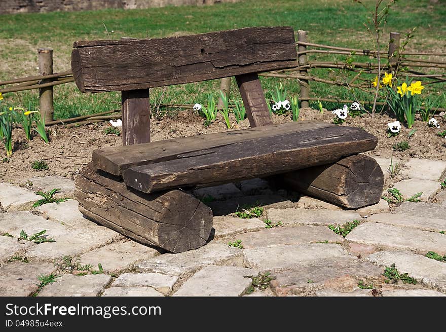 A handmade wooden bench in the garden