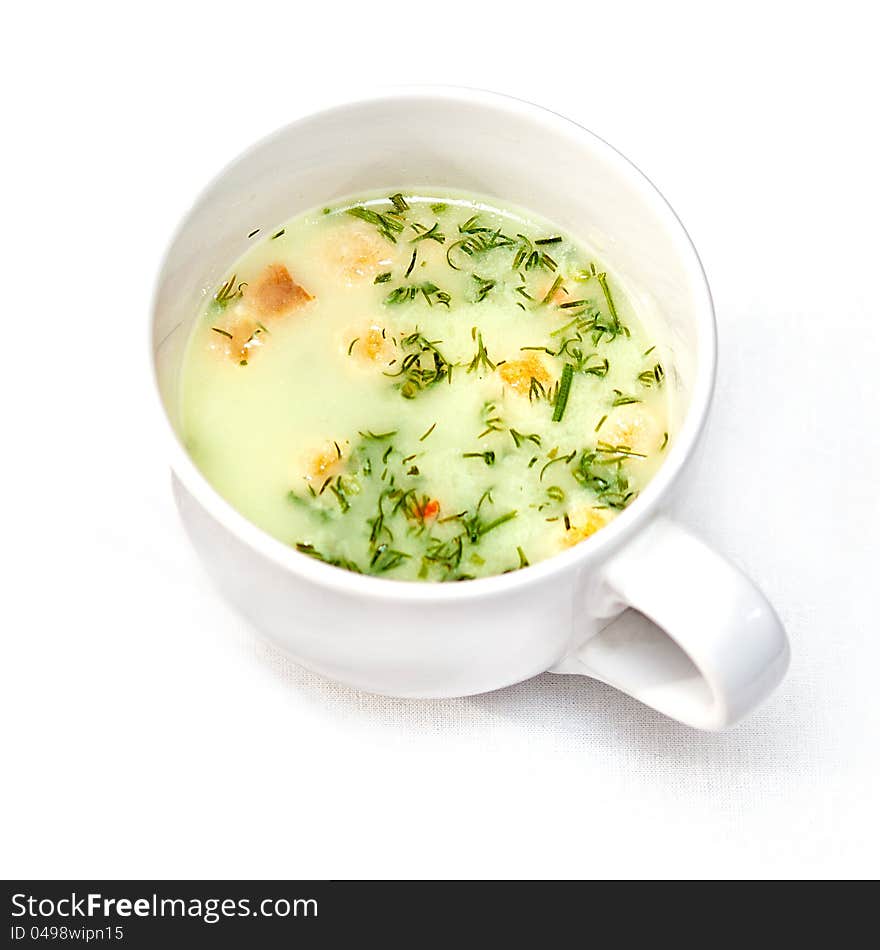 A cup of instant soup on white background