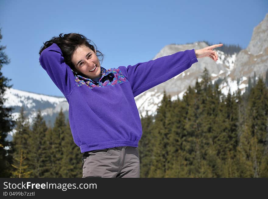 Portrait of a happy young woman at winter, in the mountains. Portrait of a happy young woman at winter, in the mountains