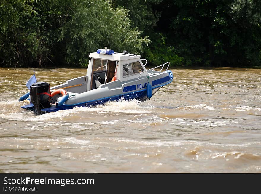 Water police motorboat patroling river