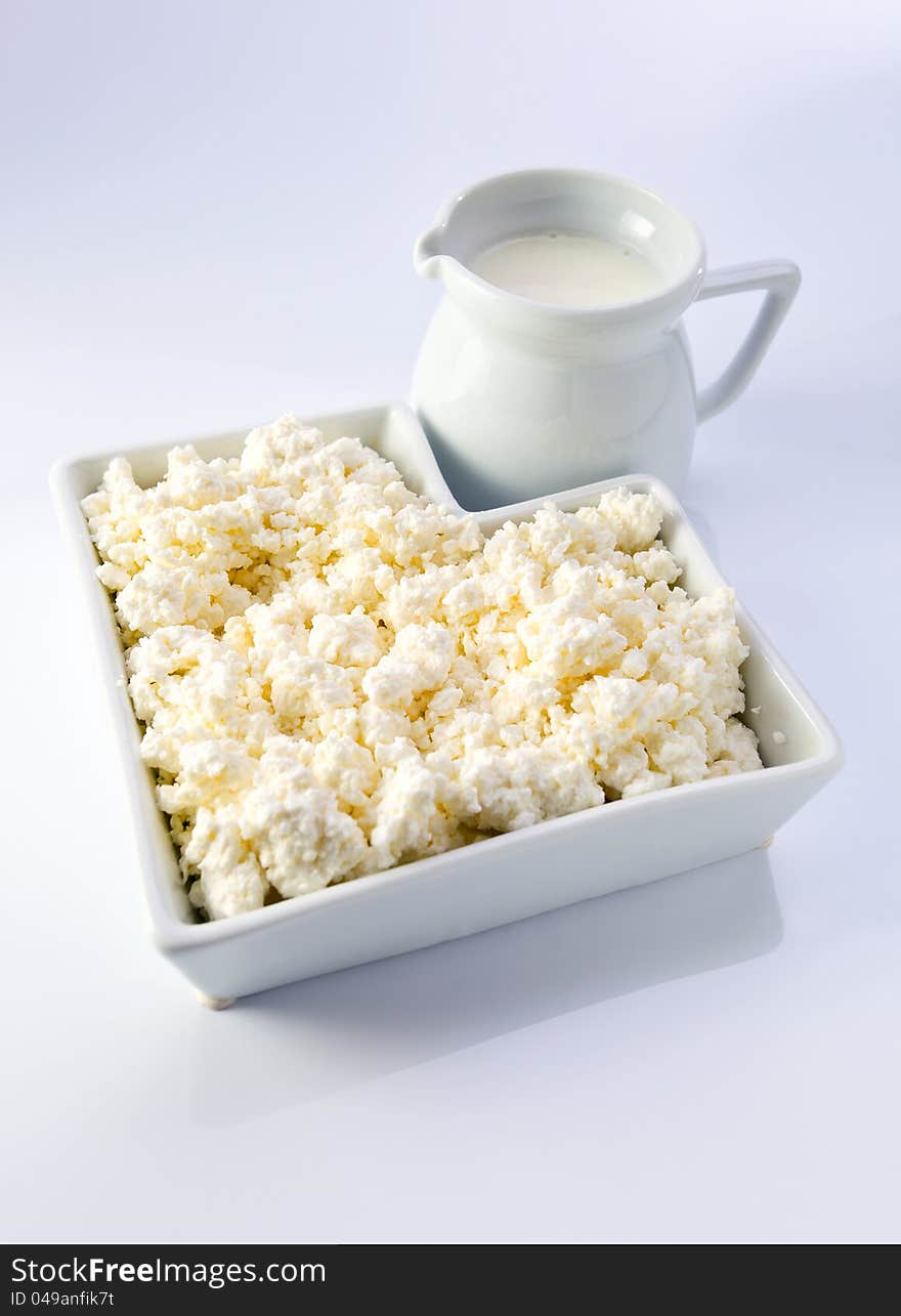 Dairy products on a white reflective background. Dairy products on a white reflective background.