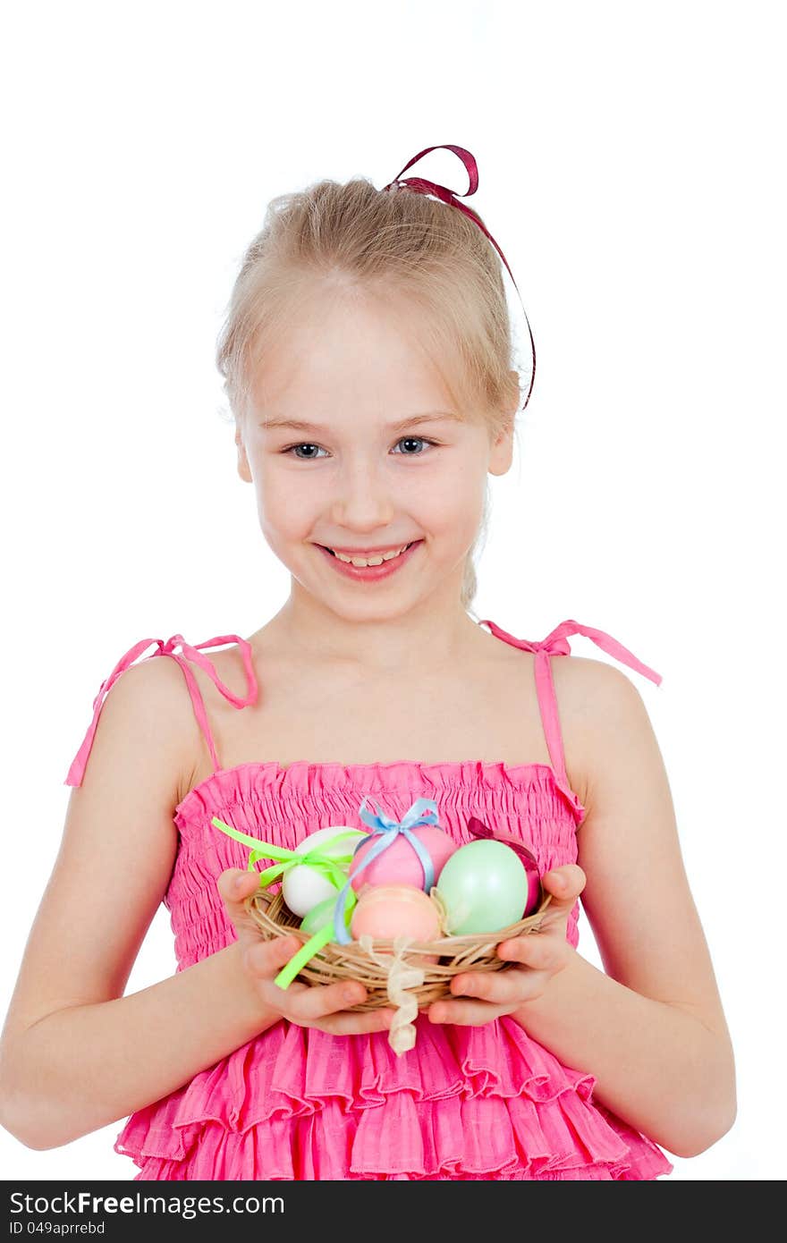 Cute smiling little girl holding Easter eggs in basket. Cute smiling little girl holding Easter eggs in basket