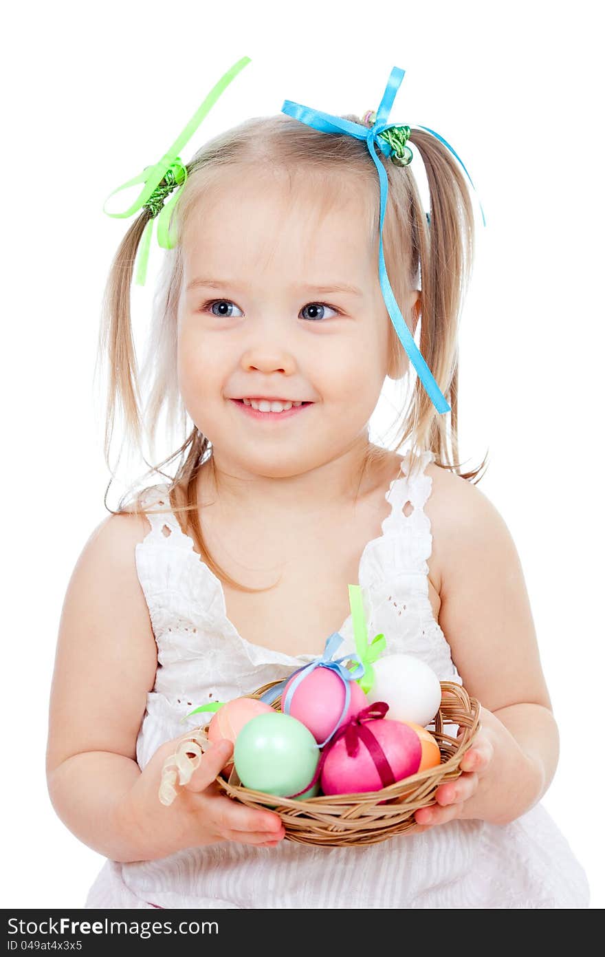 Cute smiling little girl holding Easter eggs in basket. Cute smiling little girl holding Easter eggs in basket