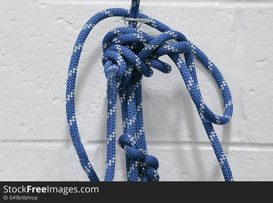 Blue rope with multiple loops and knots. Blue rope with multiple loops and knots