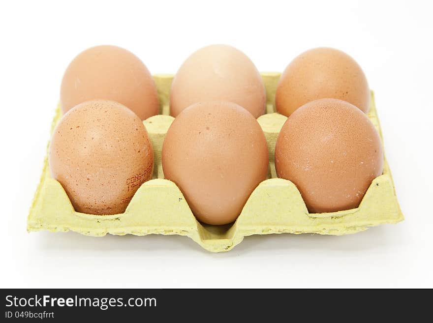 Half a dozen fresh eggs with white background