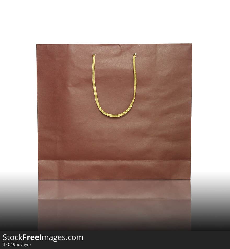 Red shopping bag on reflect floor and white background