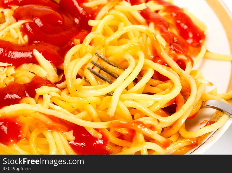 Pasta in fork on dish food background