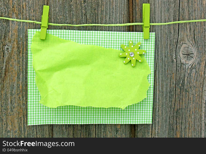 Blank letter  hanging on washing line, on wooden wall. Blank letter  hanging on washing line, on wooden wall