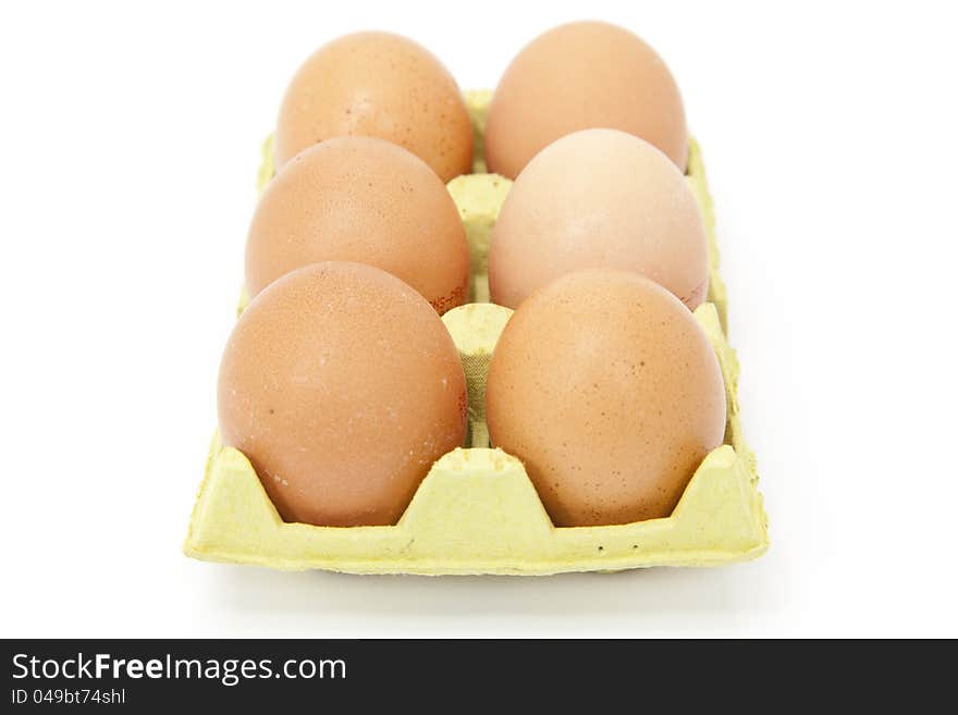 Half a dozen fresh eggs with white background