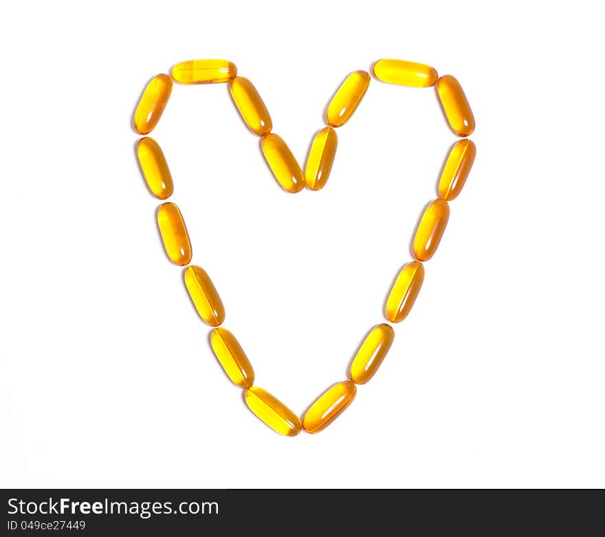 Fish oil capsule in the shape of a heart. Fish oil capsule in the shape of a heart