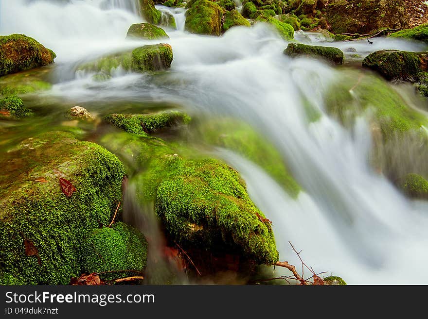 Source water flowing over rocks. Source water flowing over rocks