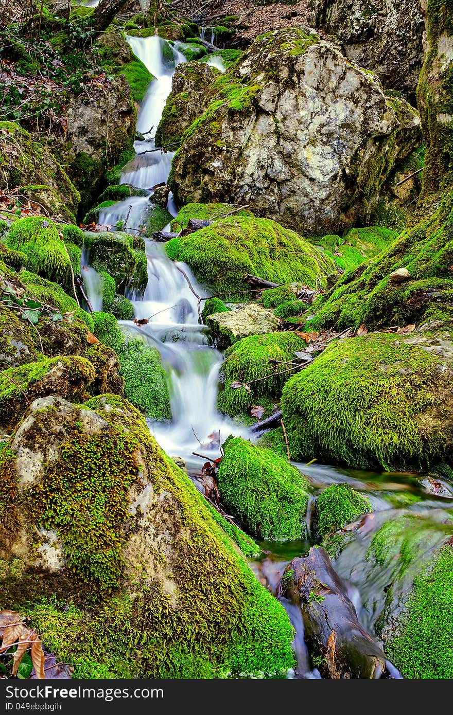 Source water flowing over rocks. Source water flowing over rocks