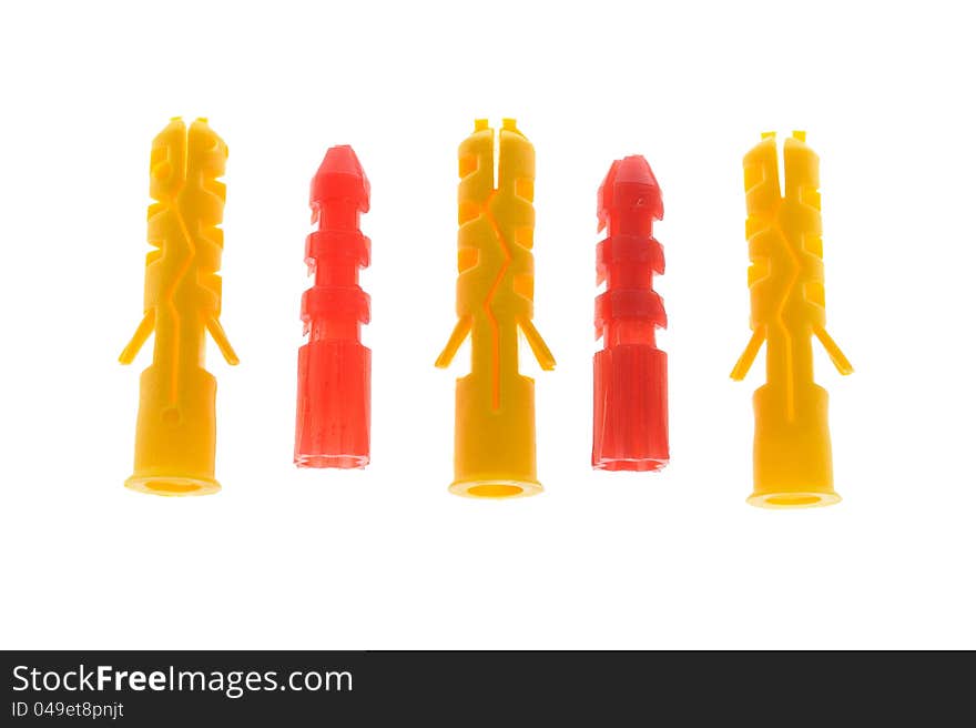 Five Colorful Plastic Dowels on White Background