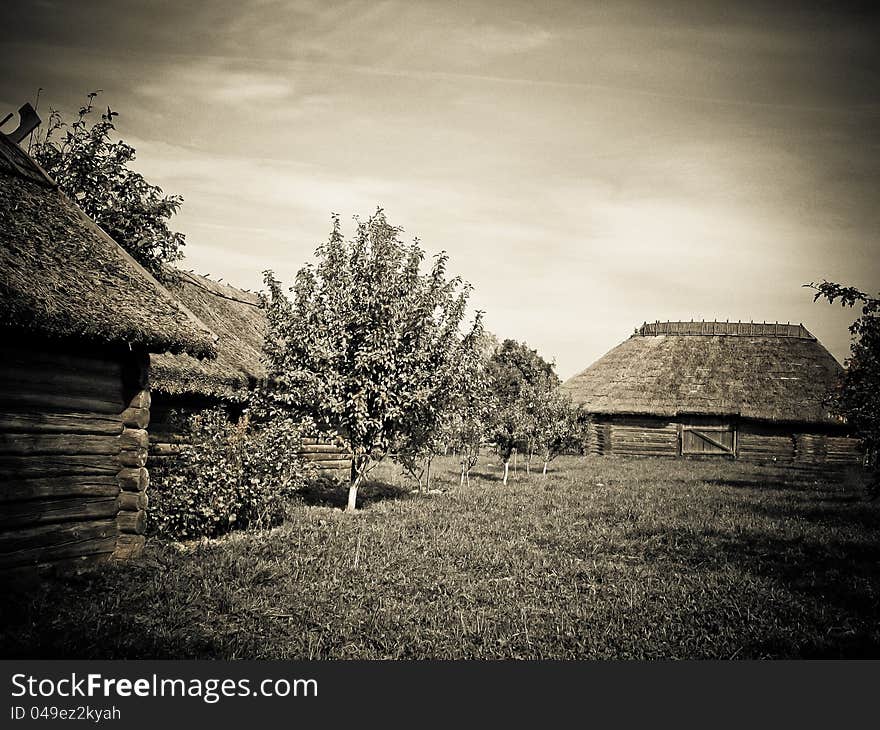 The old wooden houses with thatched roofs in the village