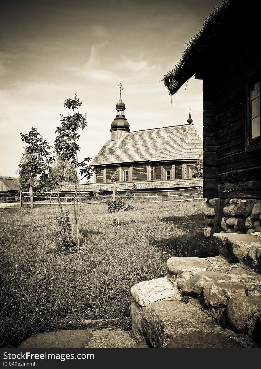 Retro landscape with an old church in Belarus.