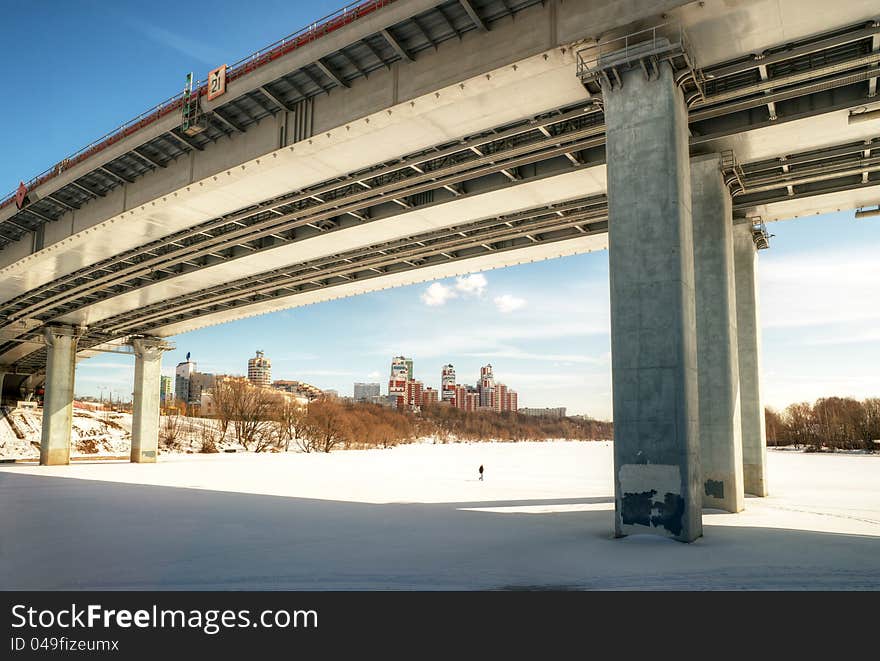 Modern bridge through a Moskva River (Zhivopisny bridge) in winter in Moscow