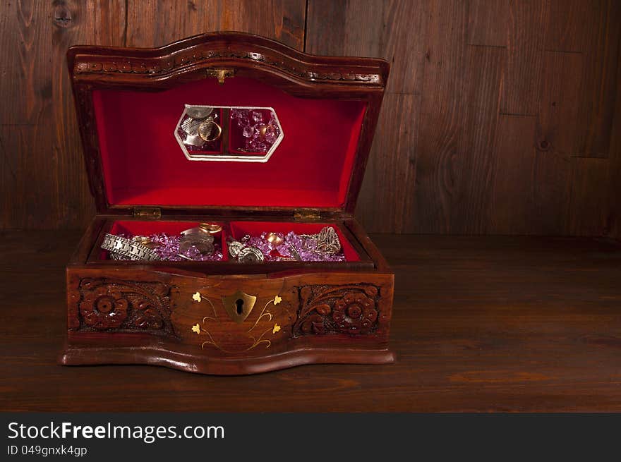 Treasure chest with jewelry coins and gems