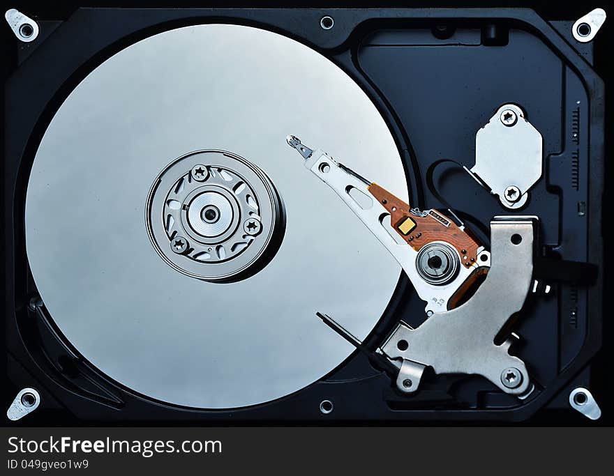 Detailed shot of a hardisk mechanics. Great image to illustrate information technology, data processing, system tools, data processing and computer hardware. Detailed shot of a hardisk mechanics. Great image to illustrate information technology, data processing, system tools, data processing and computer hardware.