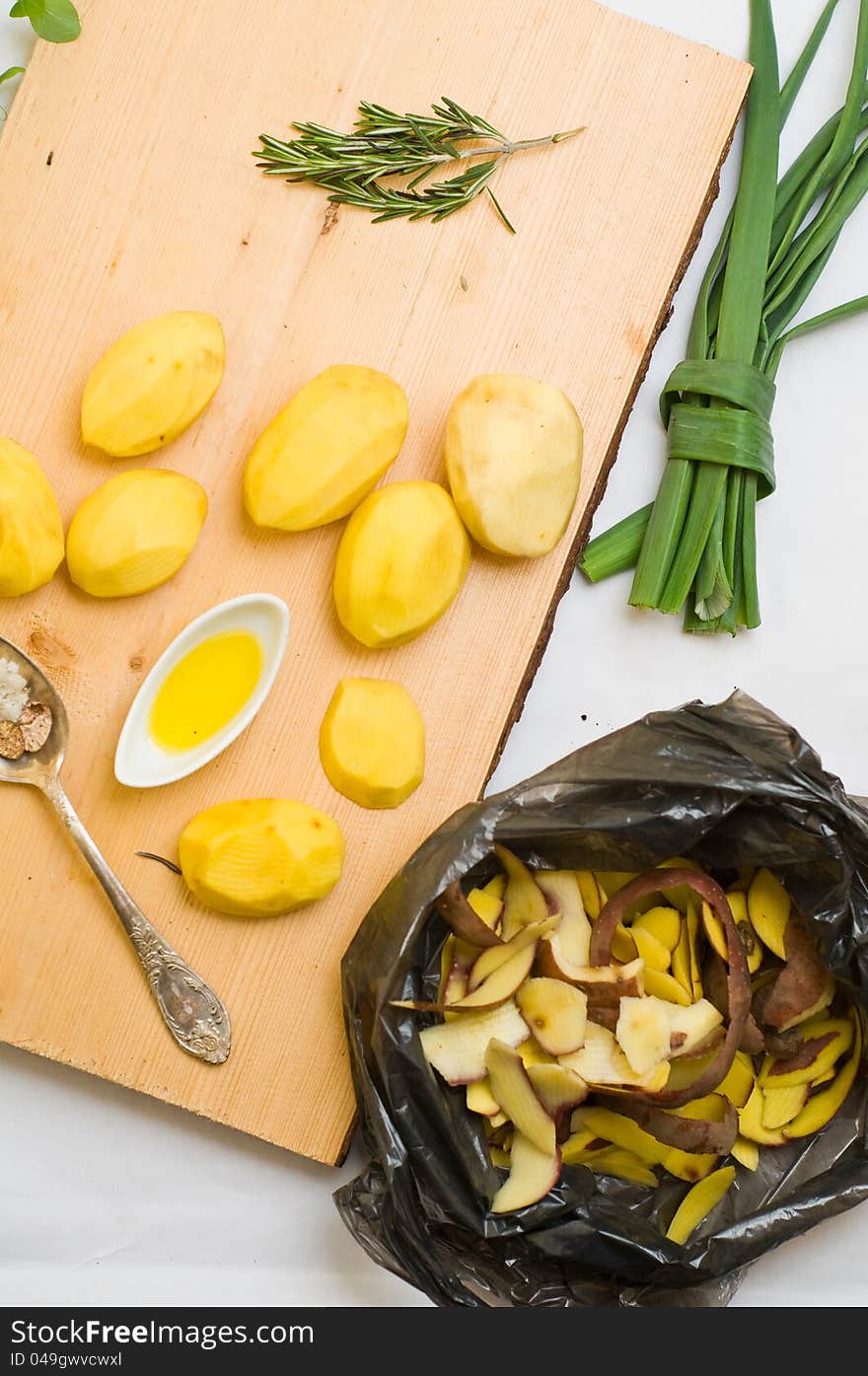 Garbage bag with potatoes peel on the table. Garbage bag with potatoes peel on the table