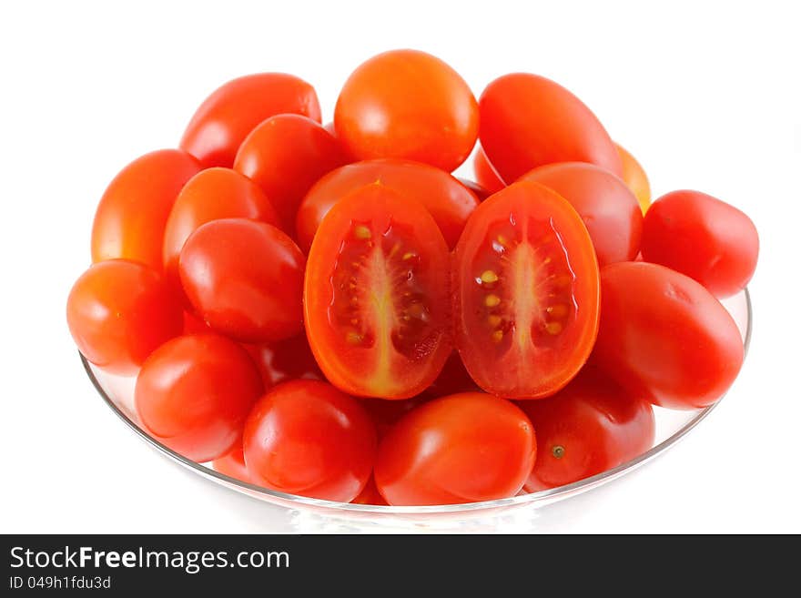 Closeup photo of fresh Cherry Tomatoes (Cocktail tomato) in a cocktail glass, isolated on white background. Closeup photo of fresh Cherry Tomatoes (Cocktail tomato) in a cocktail glass, isolated on white background