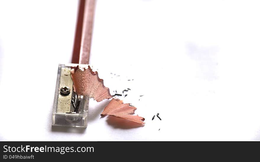 Pencil and Sharpener on White Background