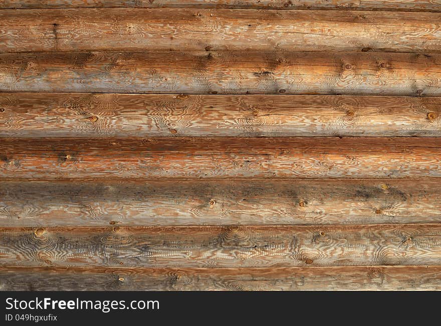 Wall of the rural house from wooden logs. Texture