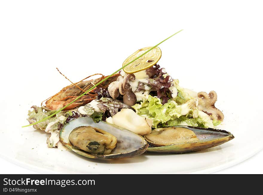 Seafood salad on a plate on a white background