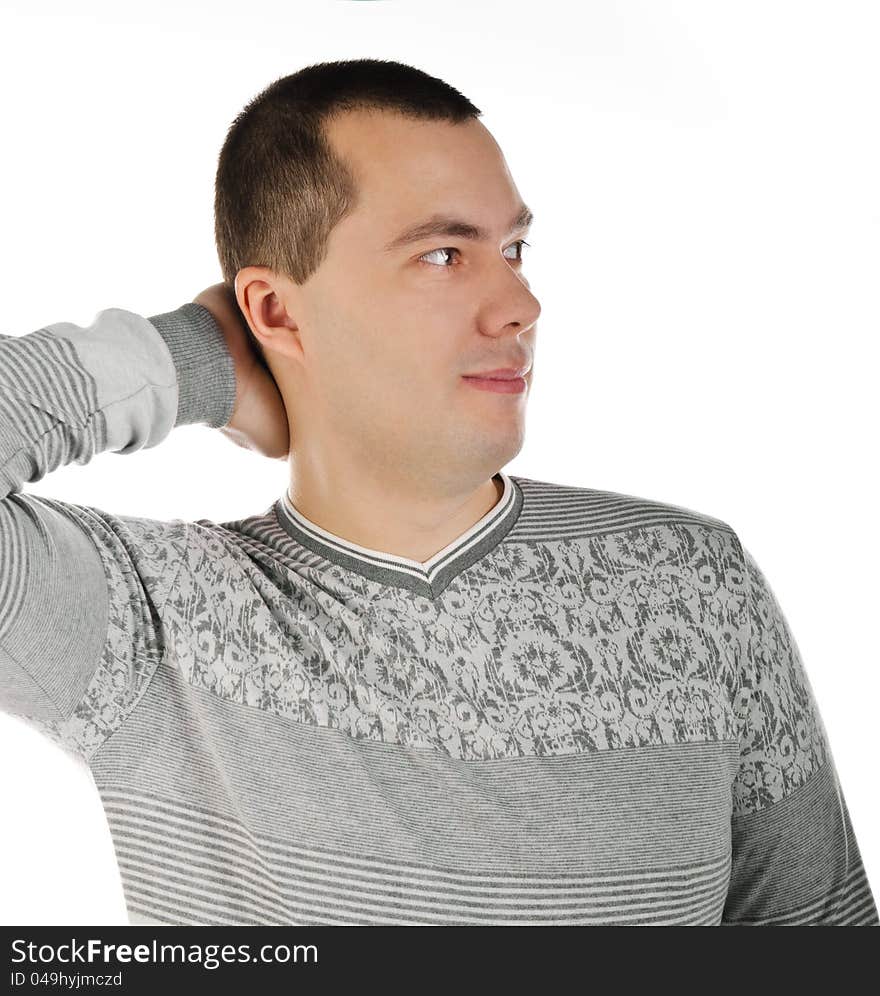 Portrait of a handsome young man looking away hand behind the head