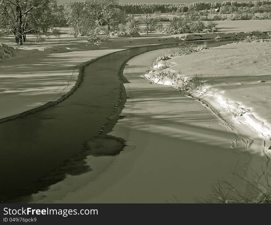 A beautiful winter scenery with views of the frozen river. A beautiful winter scenery with views of the frozen river