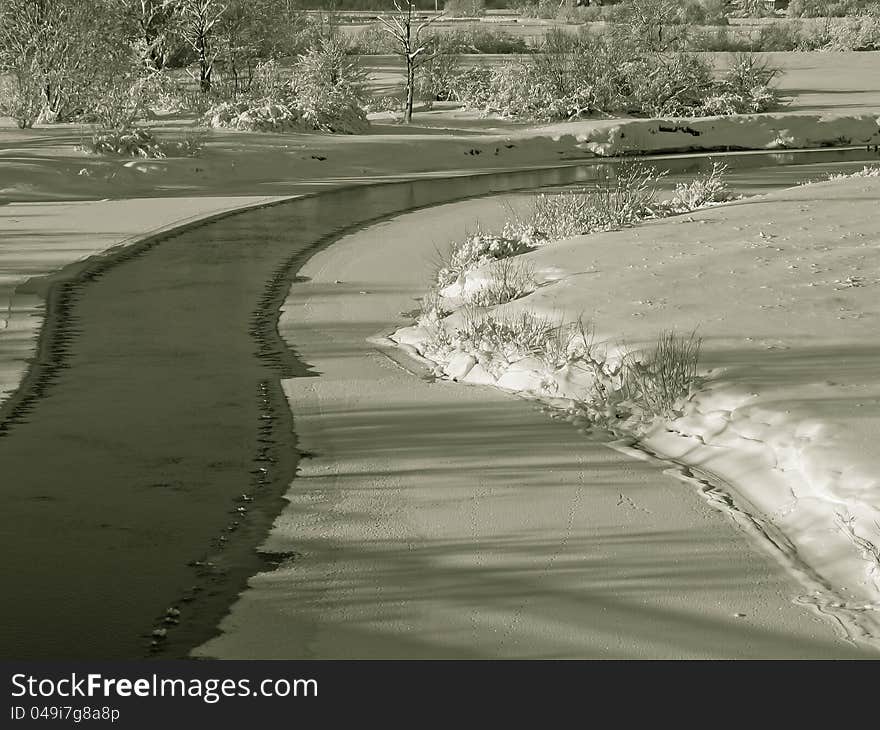 A beautiful winter scenery with views of the frozen river. A beautiful winter scenery with views of the frozen river