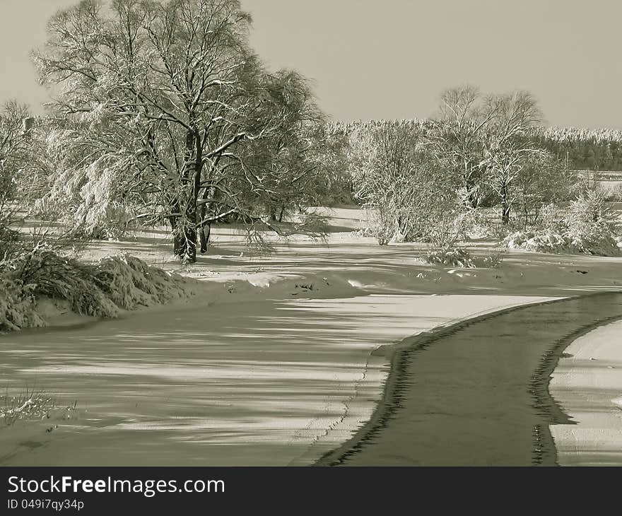 A beautiful winter scenery with views of the frozen river. A beautiful winter scenery with views of the frozen river