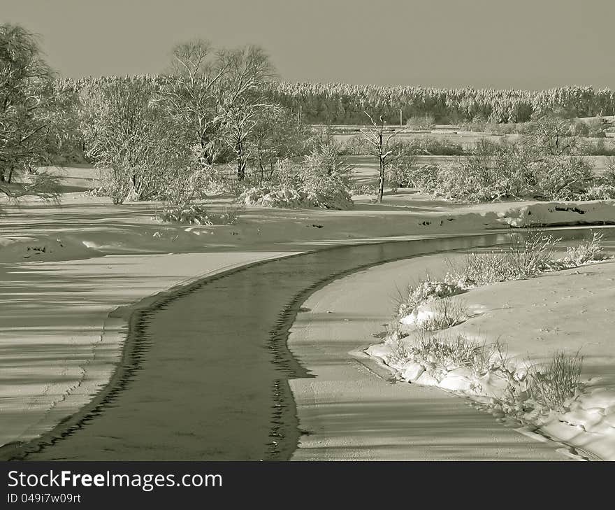 A beautiful winter scenery with views of the frozen river. A beautiful winter scenery with views of the frozen river