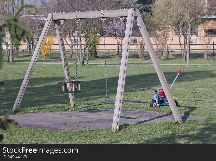 Game of the swing in public garden. Game of the swing in public garden