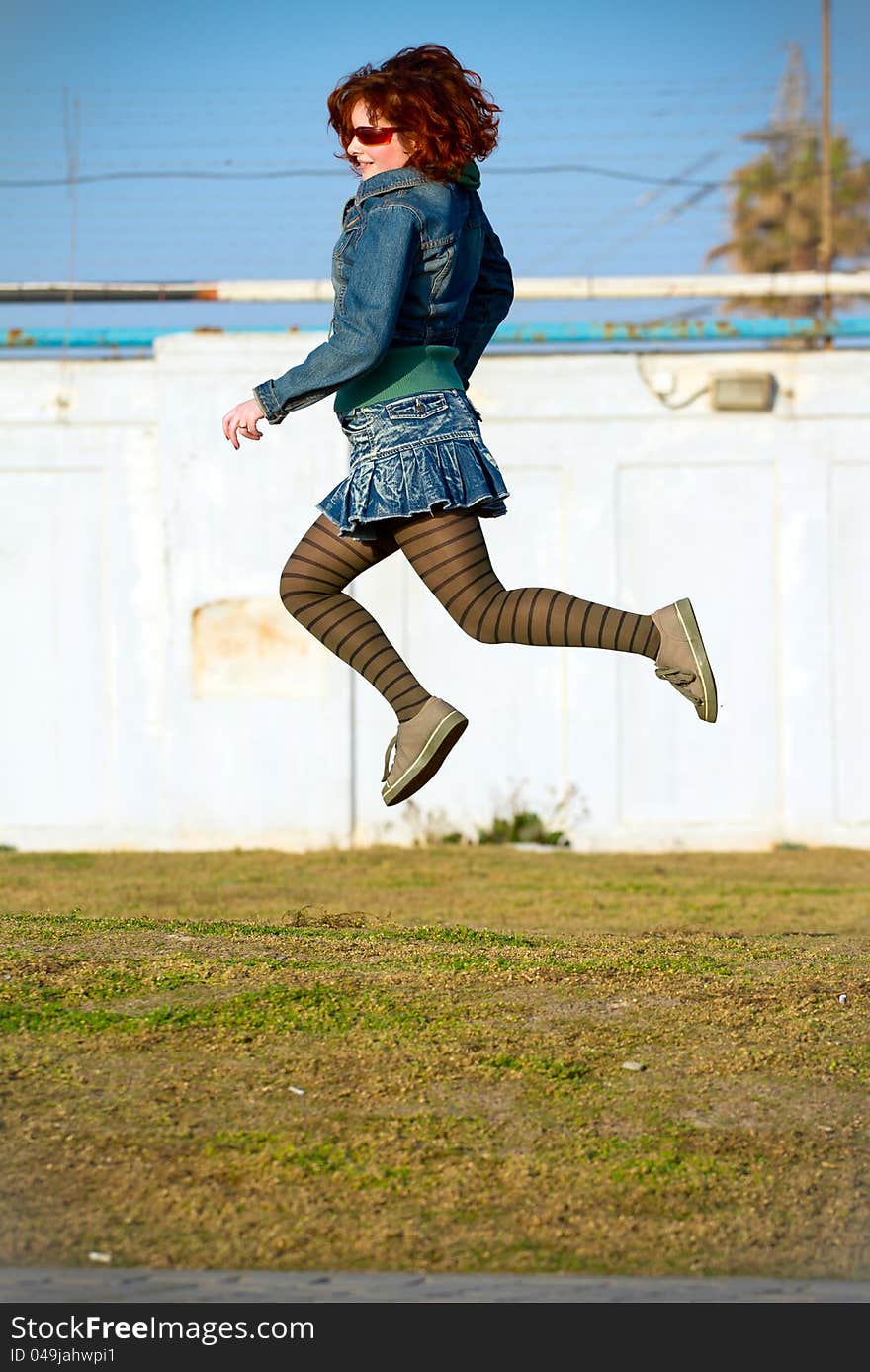 Young woman jumping high . Young woman jumping high .