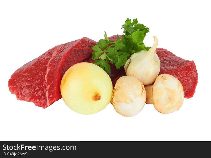 Raw meat and vegetables on white